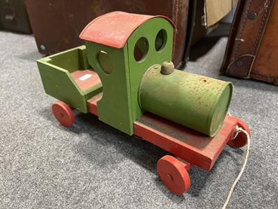 Lot 85 - Two vintage small suitcases, seven stained pine trays (possibly type trays), and a vintage pull-along train.