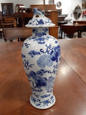 Lot 14 - Garniture of three Chinese blue and white baluster-shape vases