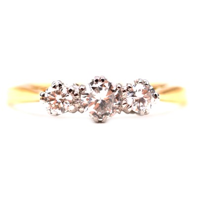 Lot 192 - A diamond three stone ring.