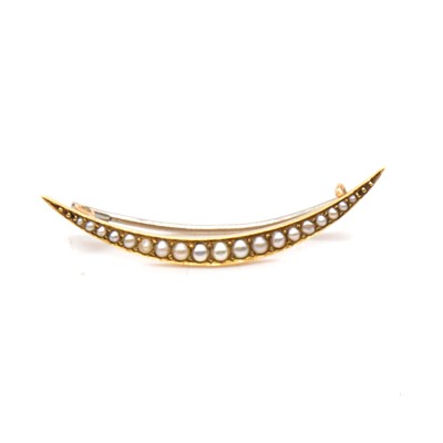 Lot 226 - A seed pearl open crescent brooch.