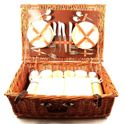 Lot 189 - A vintage fitted cane picnic basket and embossed leather stick stand.