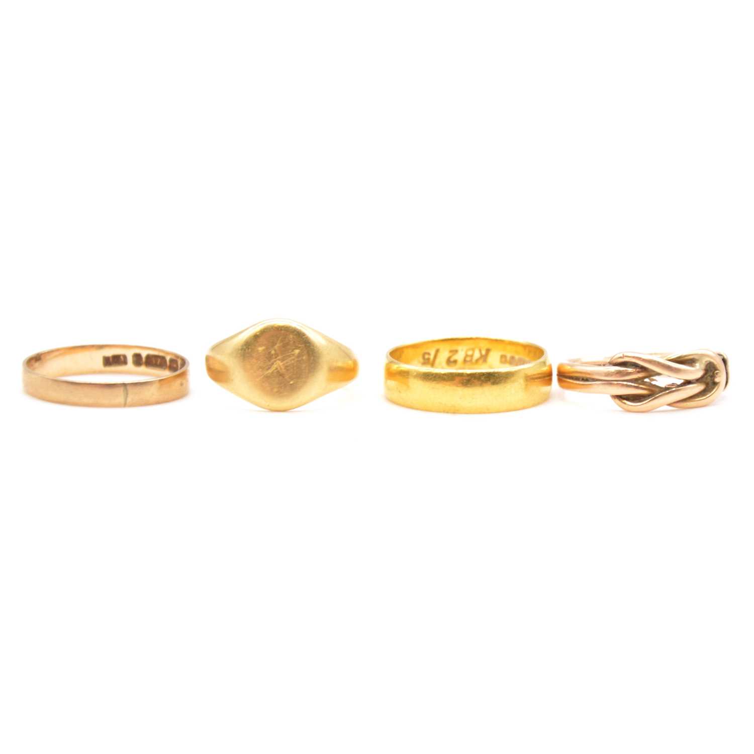 Three Rope Wedding Rings Lot 103 - Four gold rings, three wedding, knot.