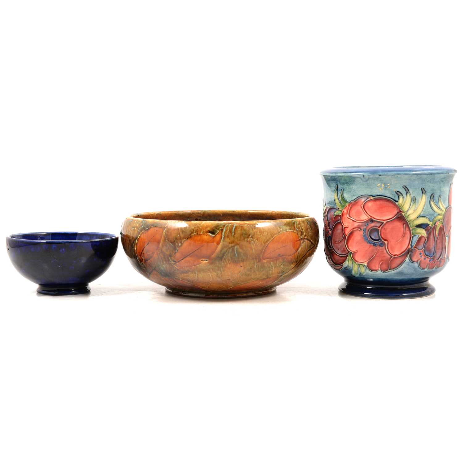 Lot 31 - Moorcroft Pottery planter, Clematis pattern, a similar bowl, and a Royal Doulton Autumn Leaf bowl