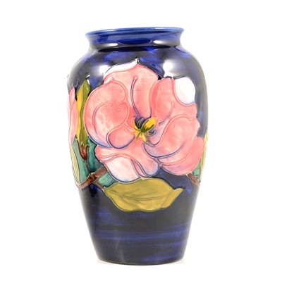 Lot 21 - Moorcroft Pottery, a 'Magnolia' design baluster vase.