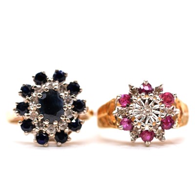 Lot 81 - A sapphire and diamond reverse cluster ring and a ruby and diamond reverse cluster ring.