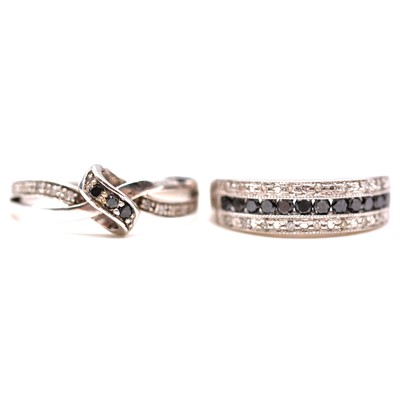 Lot 88 - Two black and white diamond rings.