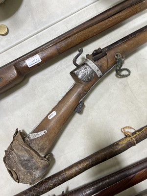 Lot 135 - Two Middle Eastern rifles and a iron-tipped spear