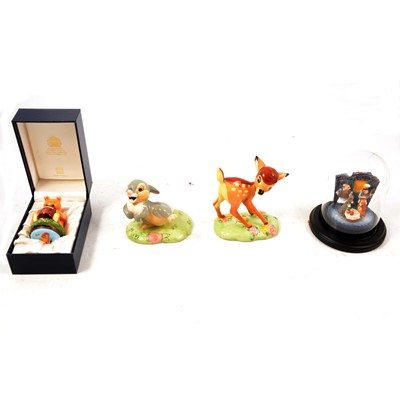Lot 51 - Four Royal Doulton, Halcyon Days and Goebel Disney and other figurines.