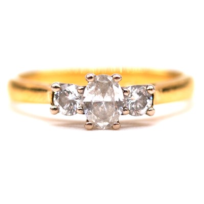 Lot 19 - A diamond three stone ring.