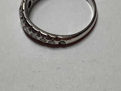 Lot 63 - A diamond half eternity ring.