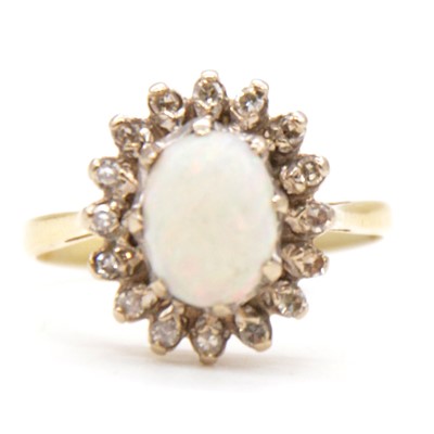 Lot 71 - An opal and diamond cluster ring.