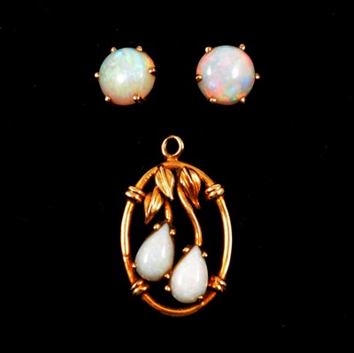 Lot 154 - An opal pendant and pair of opal earstuds.