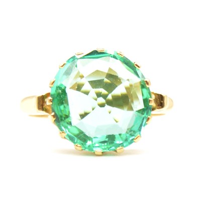 Lot 55 - A synthetic emerald solitaire ring.
