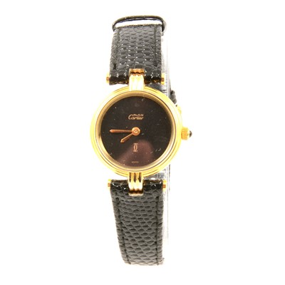 Lot 363 - Must de Cartier - a lady's gold-plated wristwatch.