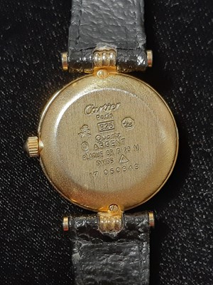 Lot 363 - Must de Cartier - a lady's gold-plated wristwatch.