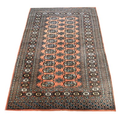 Lot 414 - Bokhara rug, two rows of thirteen guls on a...