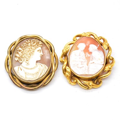 Lot 256 - Two oval carved shell cameo brooches.