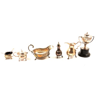 Lot 277 - Small silver pear shape cream jug, small silver trophy cup, plated condiments and sauce boats.