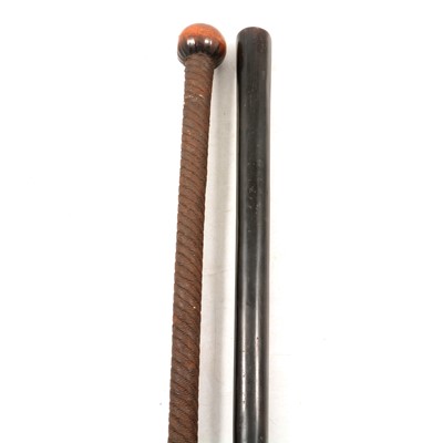 Lot 173 - Metal-clad walking cane and an ebonised stick