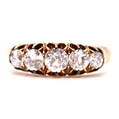 Lot 55 - A diamond five stone ring.