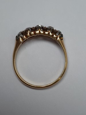 Lot 55 - A diamond five stone ring.