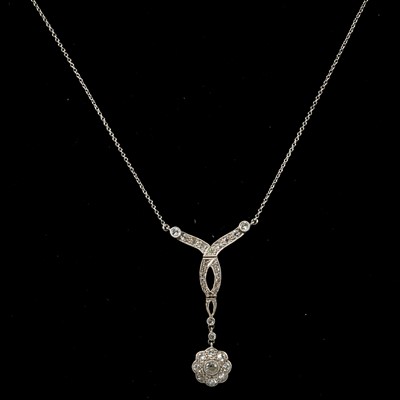 Lot 177 - An Edwardian diamond pendant and chain.