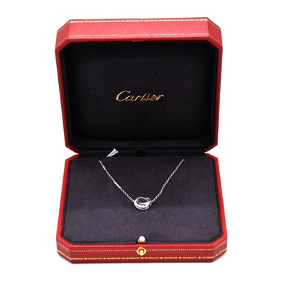 Lot 205 - Cartier - an 18 carat white gold and diamond double ring Love pendant and chain - boxed