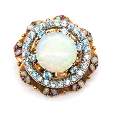 Lot 243 - An opal, blue zircon and ruby circular target brooch.