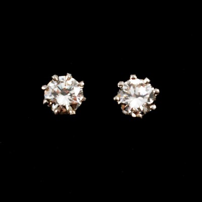 Lot 150A - A pair of diamond solitaire earstuds.