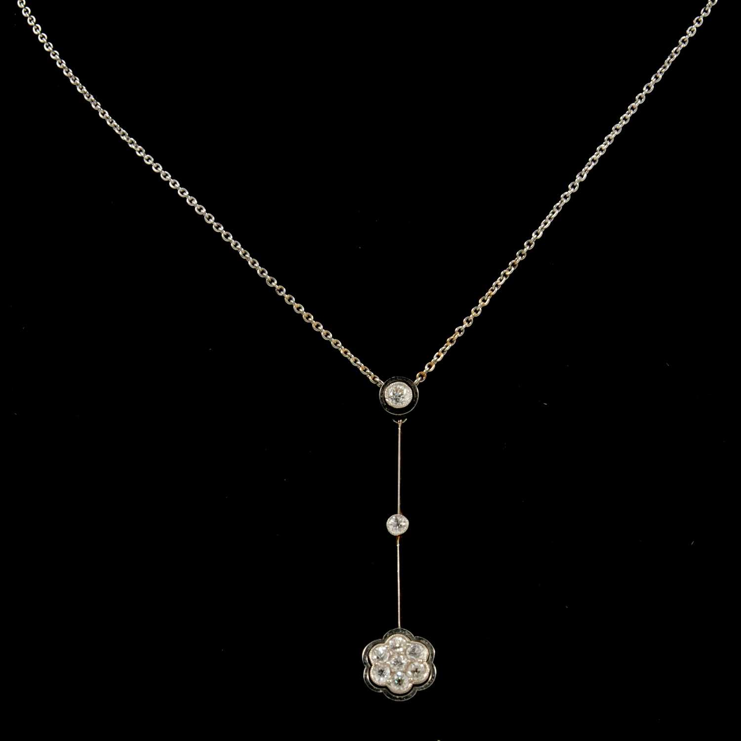 Lot 178 - A diamond drop cluster pendant.