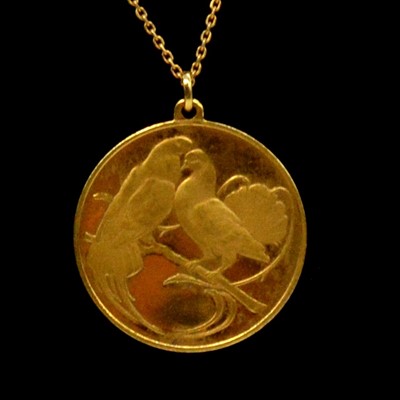 Lot 127A - An 18 carat yellow gold love medallion / pendant.