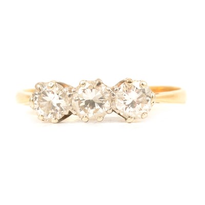 Lot 80 - A diamond three stone ring.