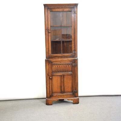 Lot 339 - Oak corner cabinet and a nest of tables by Titchmarsh & Goodwin