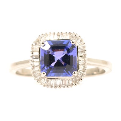 Lot 32 - A tanzanite and diamond cluster ring.