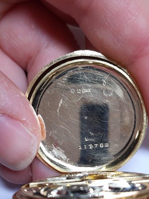 Lot 323 - An 18 carat gold open face pocket watch and metal Albert watch chain.