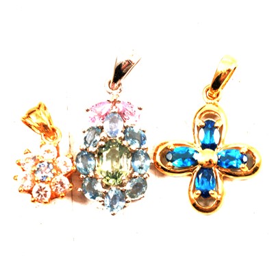 Lot 209 - Seven gemset pendants, opal, ruby, blue topaz and others.