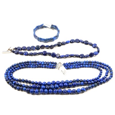 Lot 430 - Three lapis lazuli and blue stone bead necklaces and a bracelet.