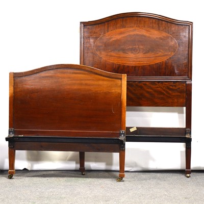 Lot 535 - Edwardian mahogany wardrobe and a pair of single bed frames