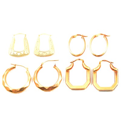 Lot 302 - Four pairs of 9 carat yellow gold and yellow metal hoop earrings.