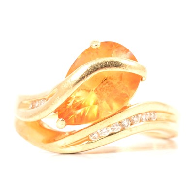 Lot 2 - A citrine and diamond crossover ring.