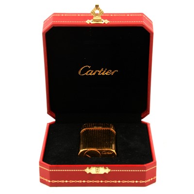 Lot 307 - Cartier - a gold-plated lighter.