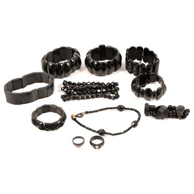 Lot 480 - Nine mixed material jet style bracelets, two rings and seven pairs of earrings.