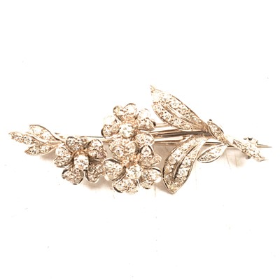 Lot 212 - A diamond floral spray brooch in a Tessiers Ltd brooch box.