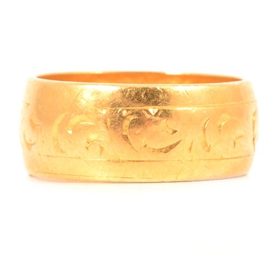 Lot 123 - A 22 carat yellow gold wedding band.