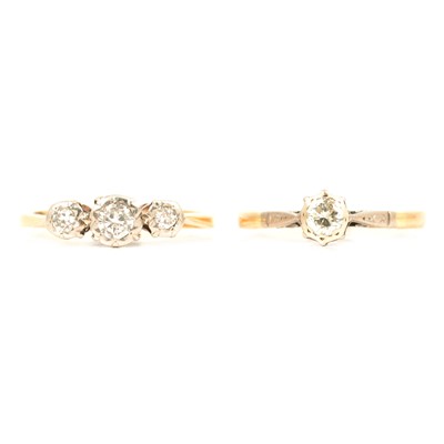 Lot 194 - A diamond solitaire ring and a three stone ring.