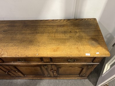 Lot 375 - Oak dining chairs and sideboard, Titchmarsh & Goodwin