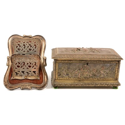 Lot 273 - A brass and metal casket with embossed putti decoration, silver letter rack.