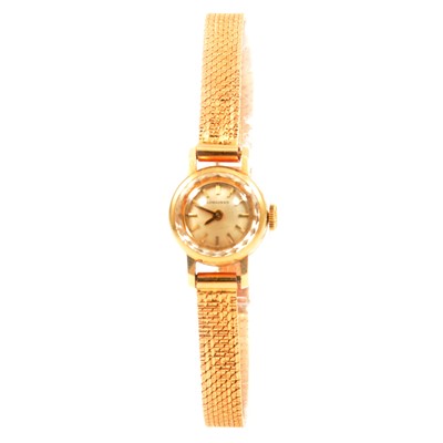 Lot 376 - Longines - a lady's 18 carat yellow gold bracelet watch.