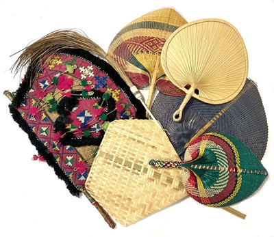 Lot 173 - Collection of woven Ethnic rigid fans, basketwork, and a fly whist.