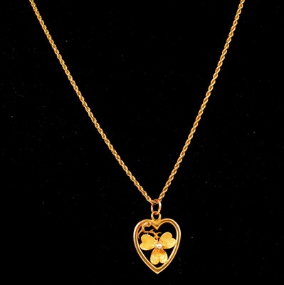 Lot 197 - A heart shaped pendant and rope link chain.